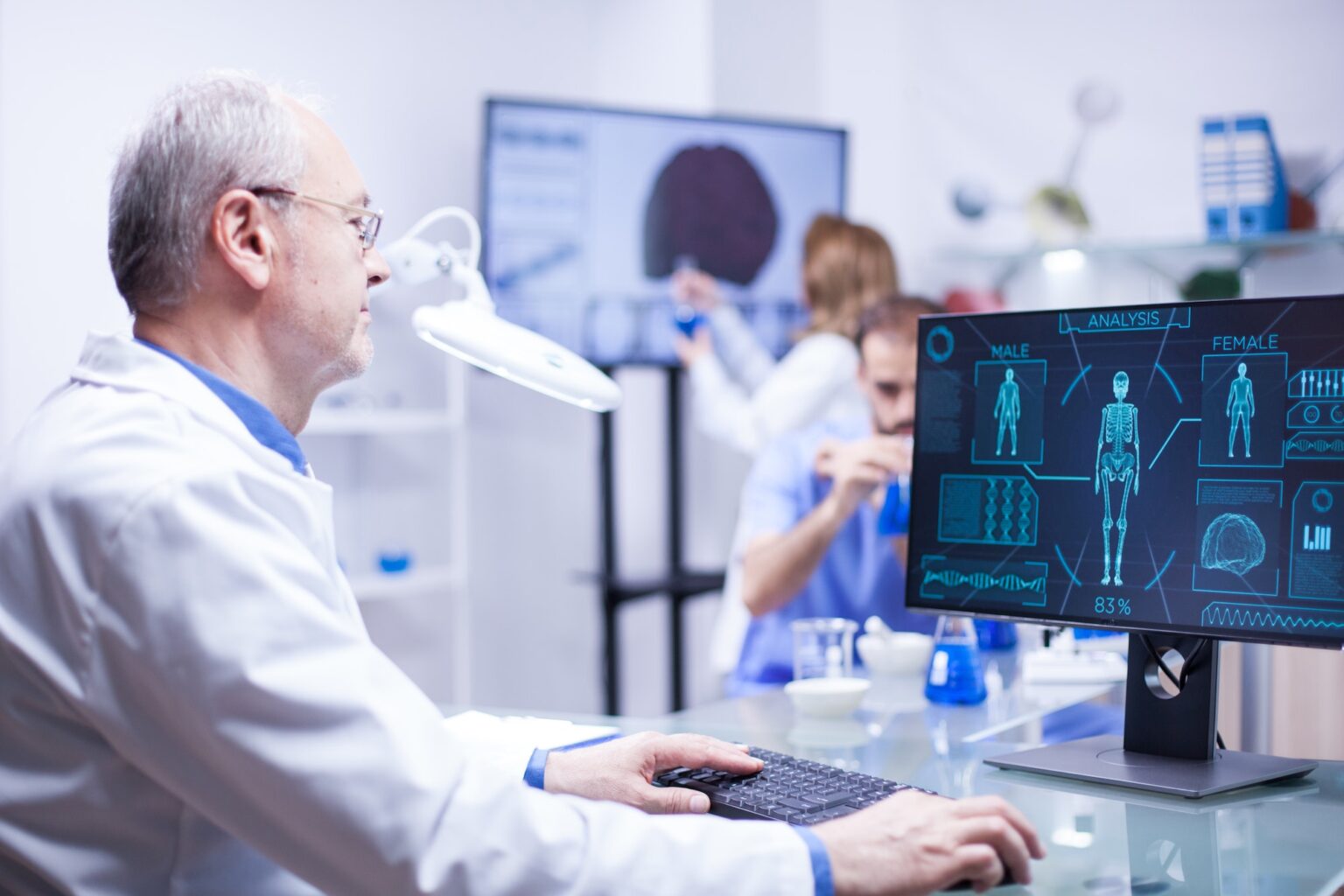 experienced-senior-technician-working-on-computer-in-a-laboratory-science